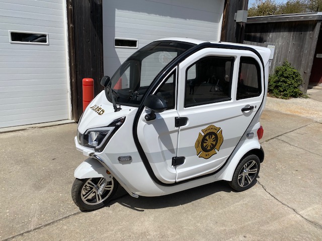 White 3-wheel electric trike for firefighter patrolling